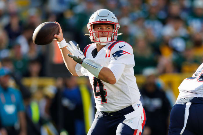 Oct 2, 2022; Green Bay, Wisconsin, USA; New England Patriots quarterback Bailey Zappe (4) throws a pass during the second quarter against the Green Bay Packers at Lambeau Field.